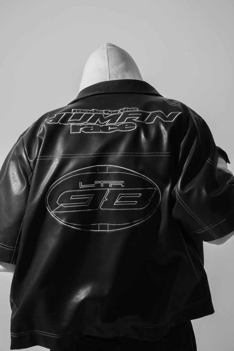 Untitled Studio fashion photo of a person wearing a jacket and hoodie,